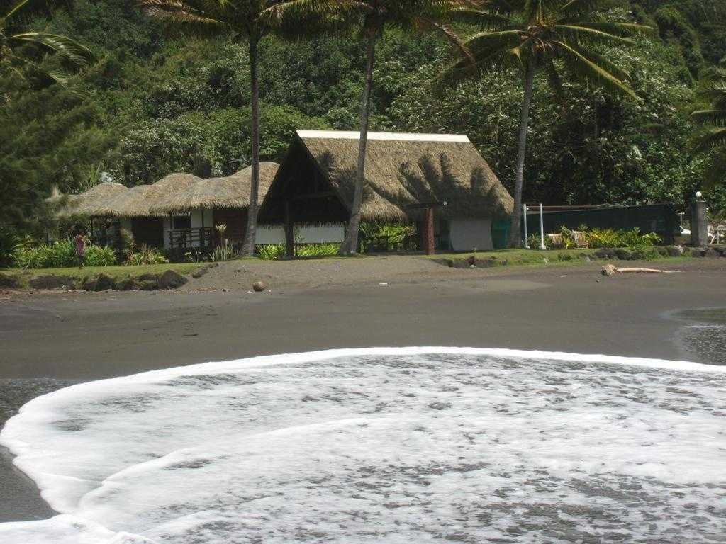 Fare Arearea beachfront bungalows on the black-sand beach of Faaone, Tahiti